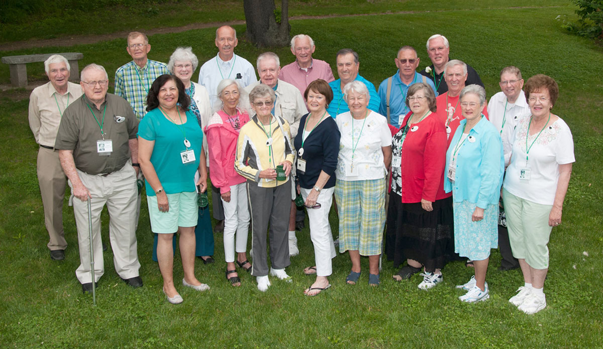 members of the Plymouth Teachers College Class of 1963, grouped and smiling