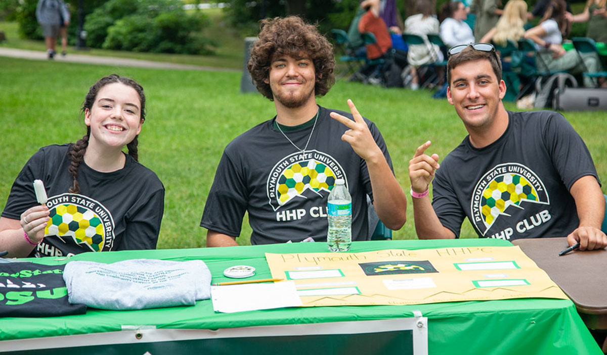 student club members at a promotional booth