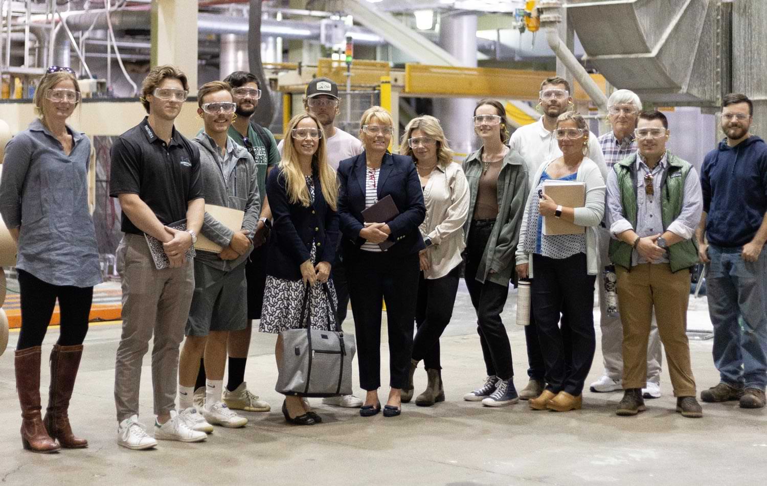Professor Chantalle Forgues and students across various disciplines photographed at White Mountain Paper Company (WMPC) in Gorham, New Hampshire