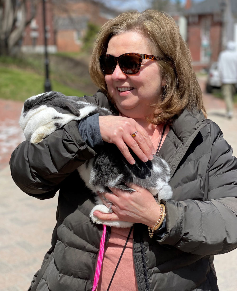Deb Naro ’02G and pet therapy rabbit at Climb Above Addiction event to prevent and reduce substance misuse