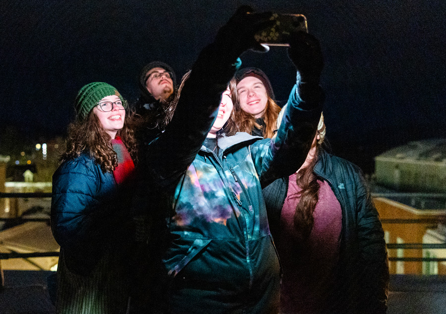 students taking a group selfie during stargazing