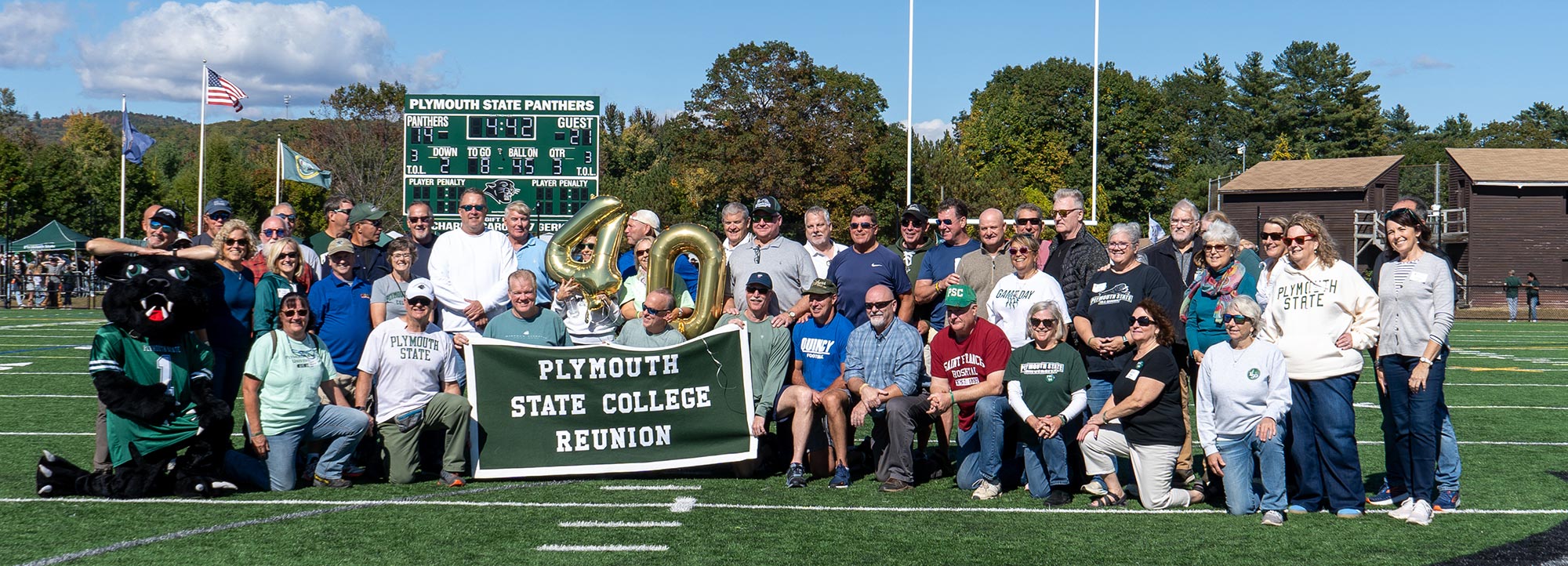 Plymouth State College Reunion group photo on the football field